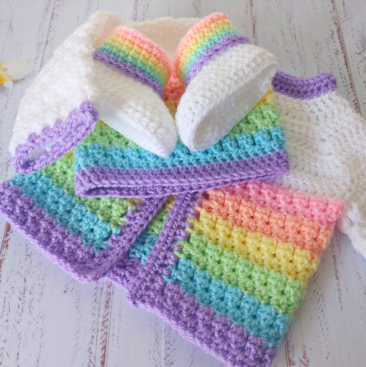 Pastel rainbow baby crochet collection of booties, hats and cardigans