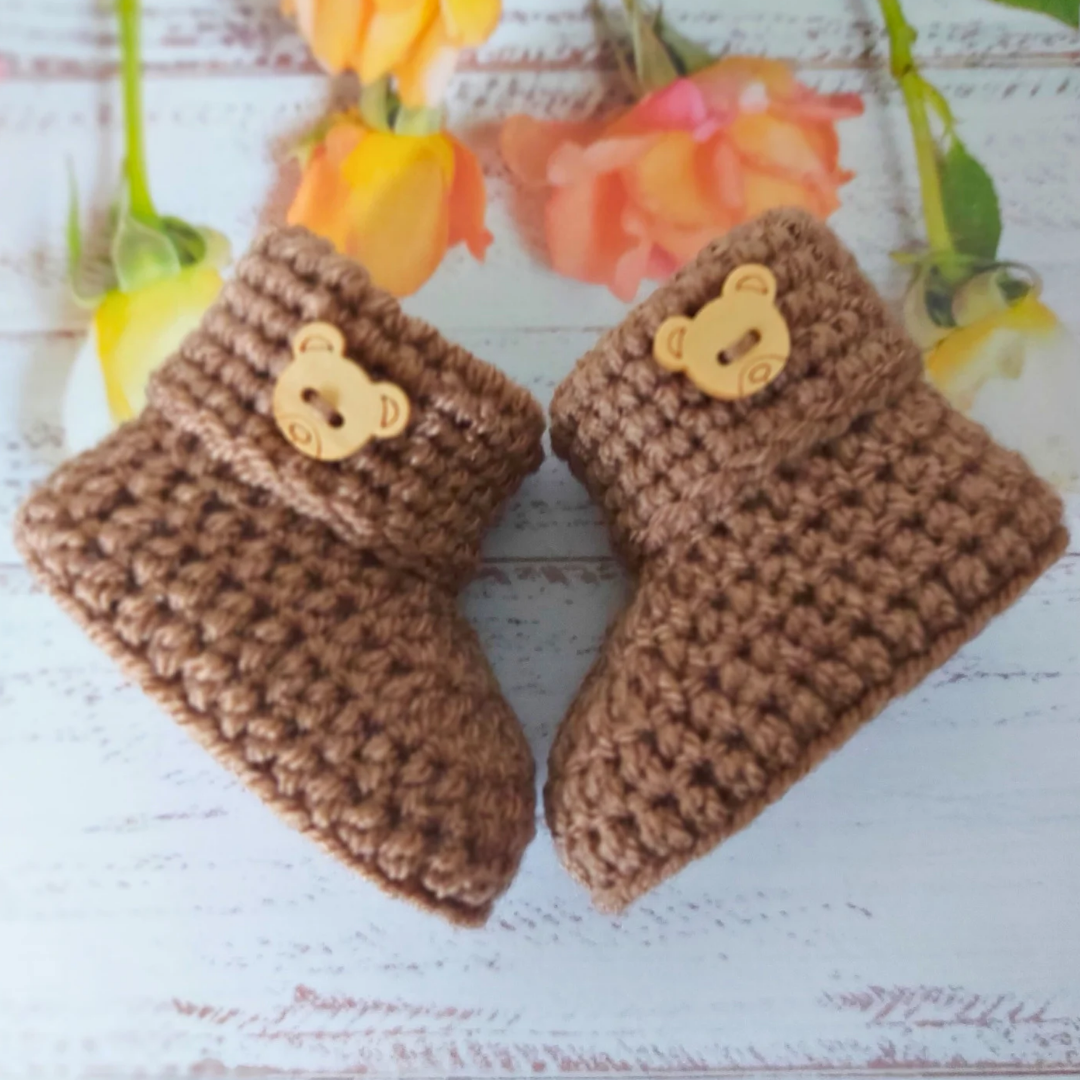 Handmade Handmade Crochet Baby Booties with Teddy Button - Sizes Newborn, 0-3 and 3-6 Months – Baby Booties crafted in soft acrylic yarn and available in multiple colours by Twisted by the Sea.