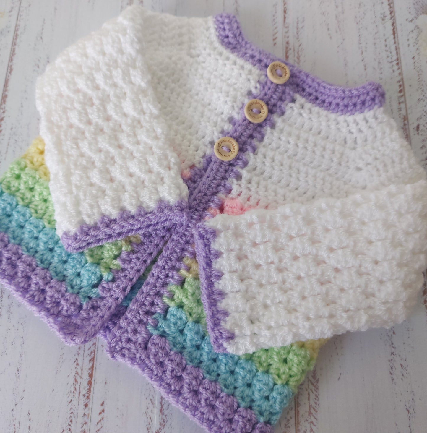 Handmade Handmade Crochet Rainbow Baby Cardigan – Sizes Newborn to 24 Months | Newborn Gift – Baby Toddler Cardigans crafted in soft acrylic yarn and available in multiple colours by Twisted by the Sea.