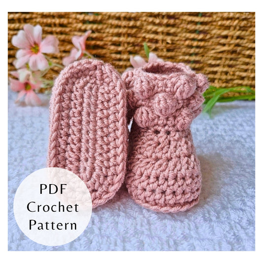 Handmade crochet pattern for bobble baby booties by Twisted by the Sea. Digital PDF download featuring US crochet terms and step-by-step photos. Pictured in pink merino wool.