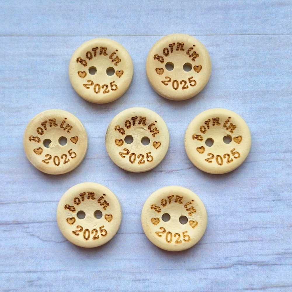 Handmade Born In 2025 Wooden Buttons – 15mm Natural Craft Buttons – Pack of 10, for Sewing, Knitting, Crochet – Buttons crafted in soft acrylic yarn and available in multiple colours by Twisted by the Sea.
