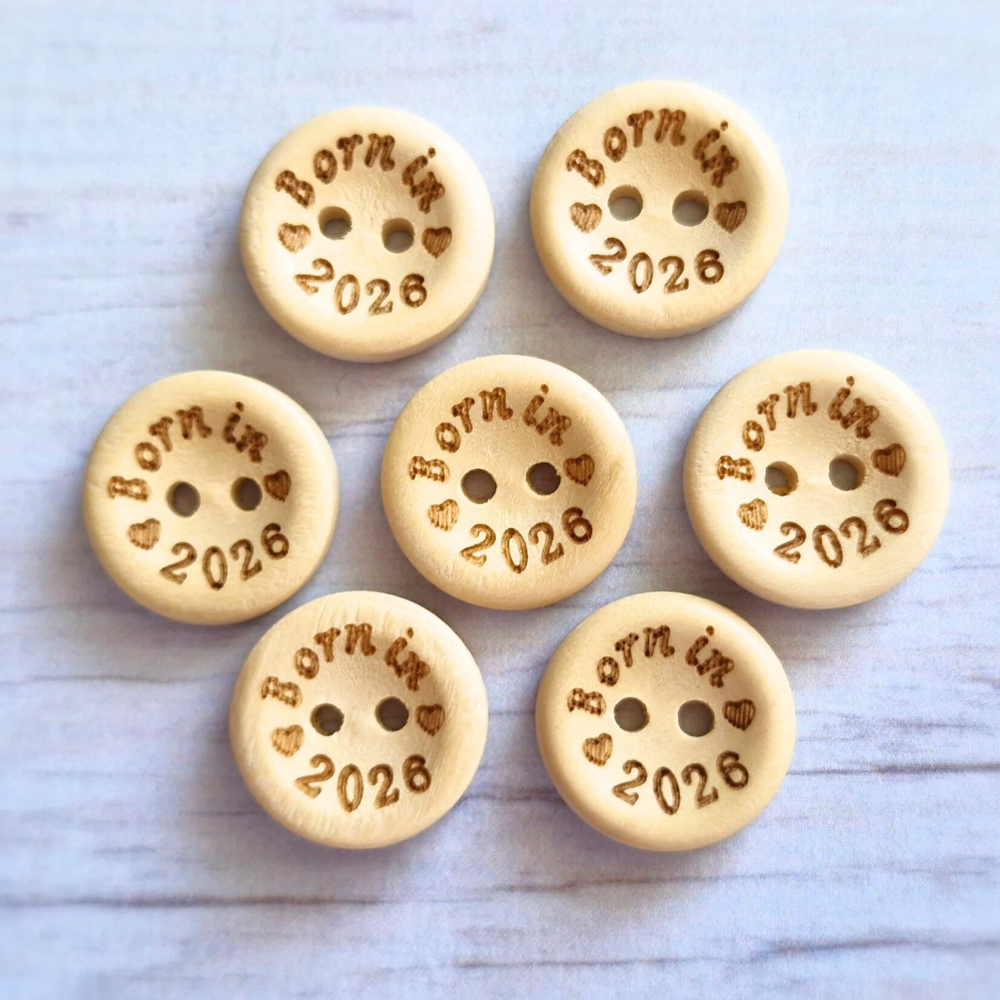 Handmade Born In 2026 Wooden Buttons – 15mm Natural Craft Buttons – Pack of 10, for Sewing, Knitting, Crochet – Buttons crafted in soft acrylic yarn and available in multiple colours by Twisted by the Sea.