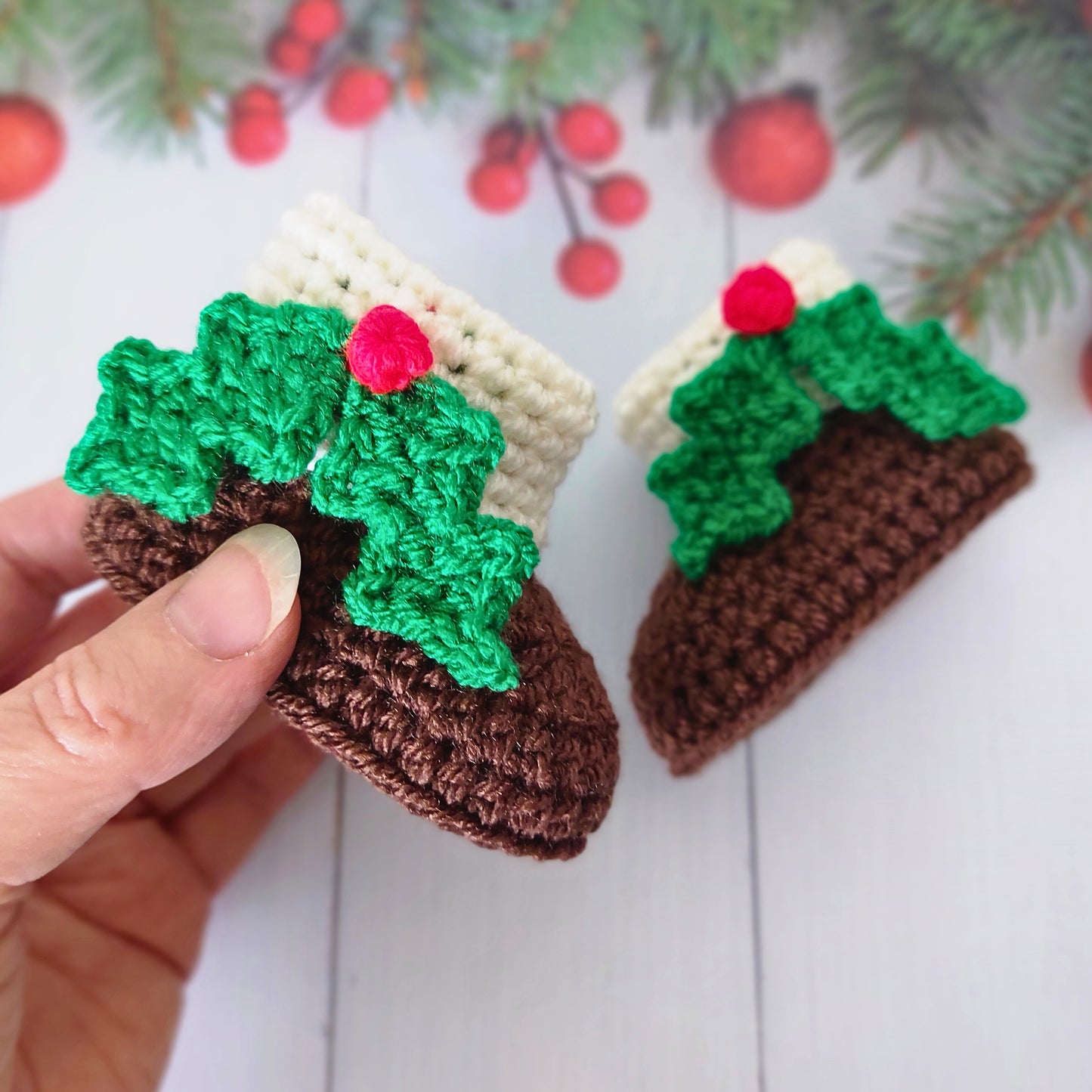 Handmade Christmas Pudding Baby Booties – Handmade Crochet Gift for Newborns – Baby Booties crafted in soft acrylic yarn and available in multiple colours by Twisted by the Sea.