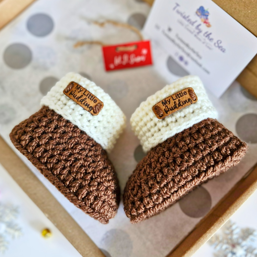 Handmade Crochet Christmas Baby Gift Set – Pudding Hat & Booties for Newborn to 6 Months – Hat and Bootie Set crafted in soft acrylic yarn and available in multiple colours by Twisted by the Sea.