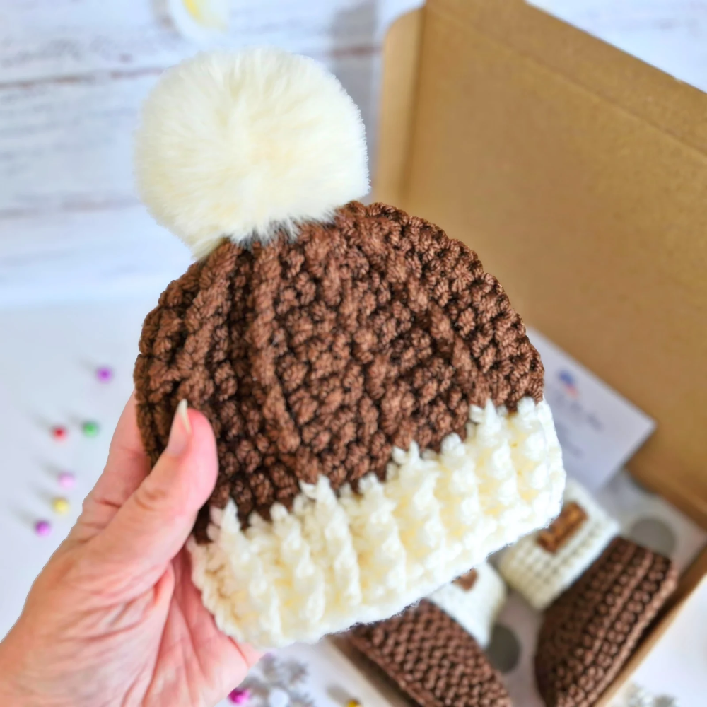 Handmade Crochet Christmas Baby Gift Set – Pudding Hat & Booties for Newborn to 6 Months – Hat and Bootie Set crafted in soft acrylic yarn and available in multiple colours by Twisted by the Sea.