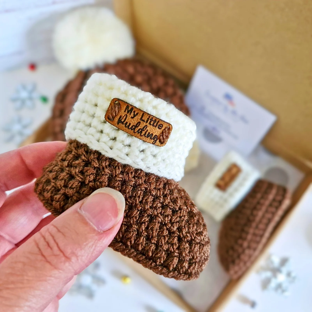 Handmade Crochet Christmas Baby Gift Set – Pudding Hat & Booties for Newborn to 6 Months – Hat and Bootie Set crafted in soft acrylic yarn and available in multiple colours by Twisted by the Sea.