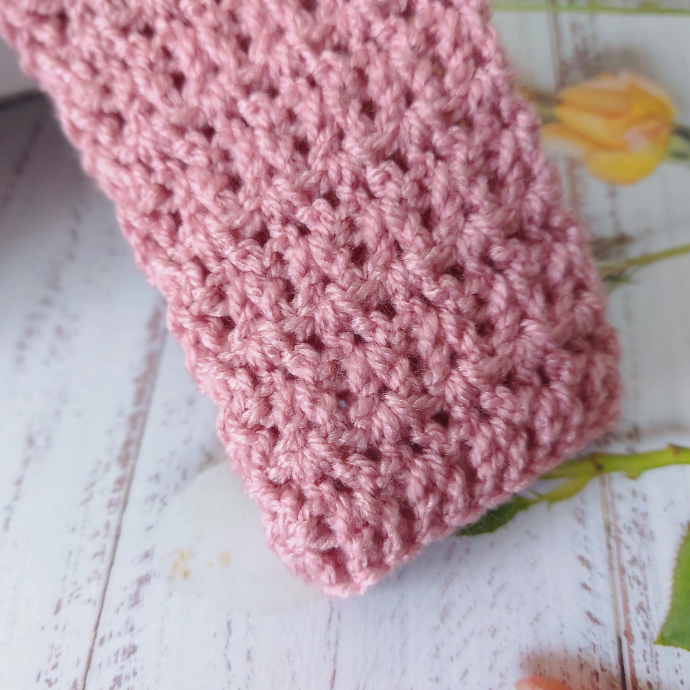 Handmade Crochet Daisy Baby Cardigan – Handmade in sizes 12 to 24 Months – Baby Toddler Cardigans crafted in soft acrylic yarn and available in multiple colours by Twisted by the Sea.