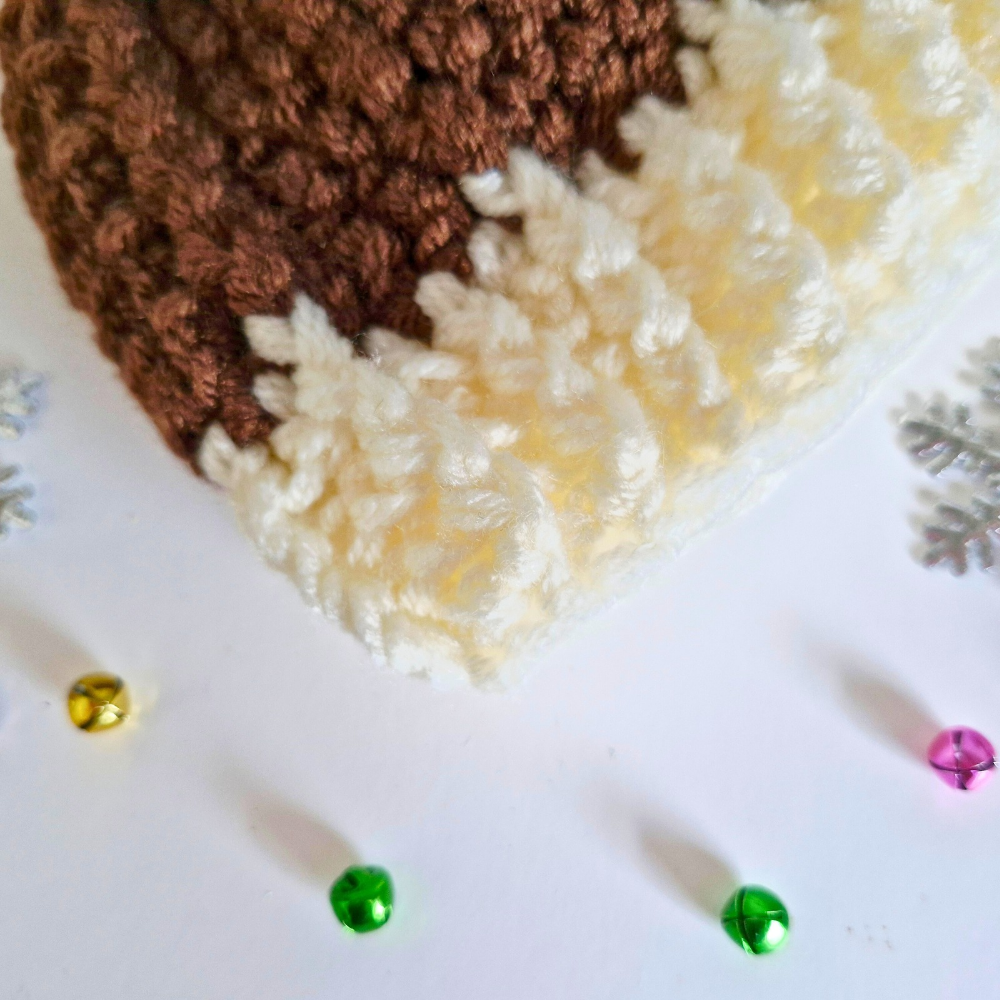 Handmade Christmas Pudding Baby Hat – Handmade Crochet Pom Pom Hat – Pom Pom Hat crafted in soft acrylic yarn and available in multiple colours by Twisted by the Sea.