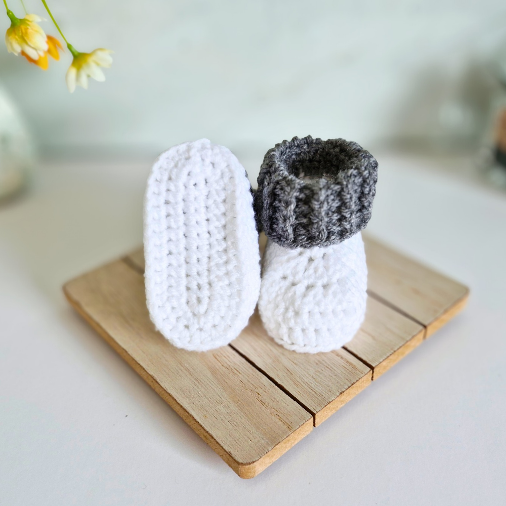 Handmade Handmade White Crochet Baby Booties with Coloured Cuff – Newborn Gift Idea – Baby Booties crafted in soft acrylic yarn and available in multiple colours by Twisted by the Sea.