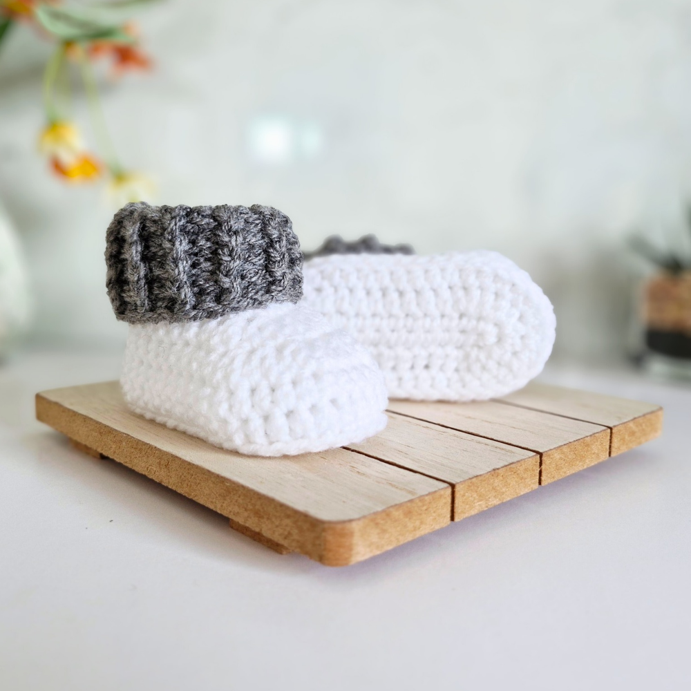 Handmade Handmade White Crochet Baby Booties with Coloured Cuff – Newborn Gift Idea – Baby Booties crafted in soft acrylic yarn and available in multiple colours by Twisted by the Sea.