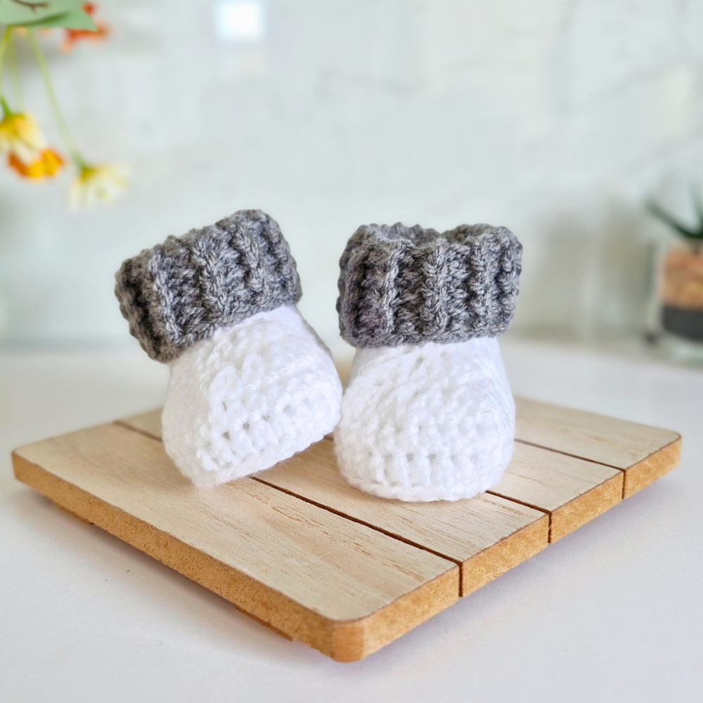 Handmade Handmade White Crochet Baby Booties with Coloured Cuff – Newborn Gift Idea – Baby Booties crafted in soft acrylic yarn and available in multiple colours by Twisted by the Sea.