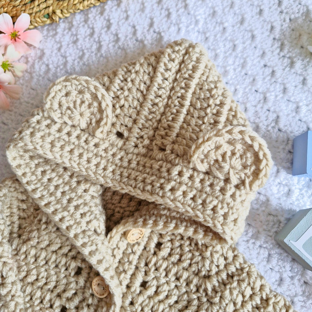 Handmade Crochet Baby Hooded Cardigan – Newborn to 12 Months – Baby Toddler Cardigans crafted in soft acrylic yarn and available in multiple colours by Twisted by the Sea.