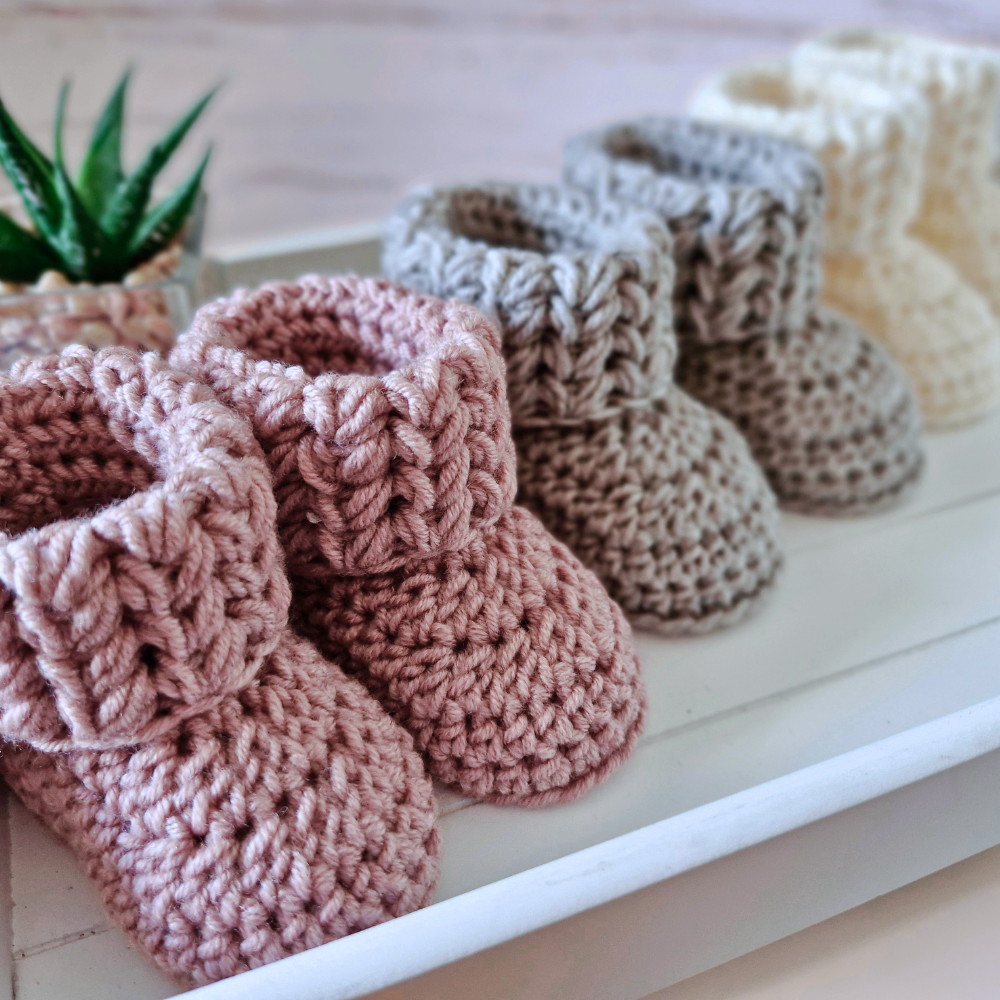 Handmade Handmade Crochet Baby Booties – Newborn to 6 Months | Baby Shower Gift – Baby Booties crafted in soft acrylic yarn and available in multiple colours by Twisted by the Sea.