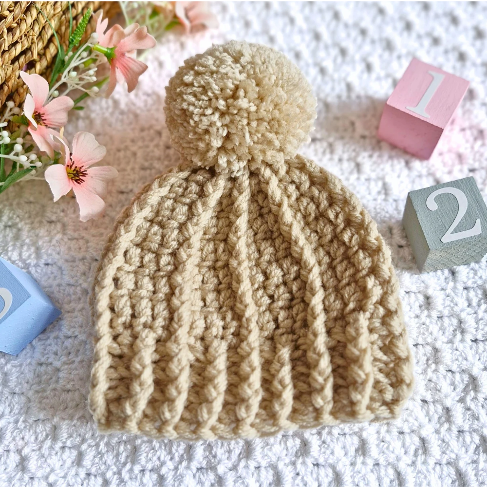 Handmade Handmade Crochet Pom Pom Baby Hat – Newborn to 12 Months – Beanie Hat crafted in soft acrylic yarn and available in multiple colours by Twisted by the Sea.