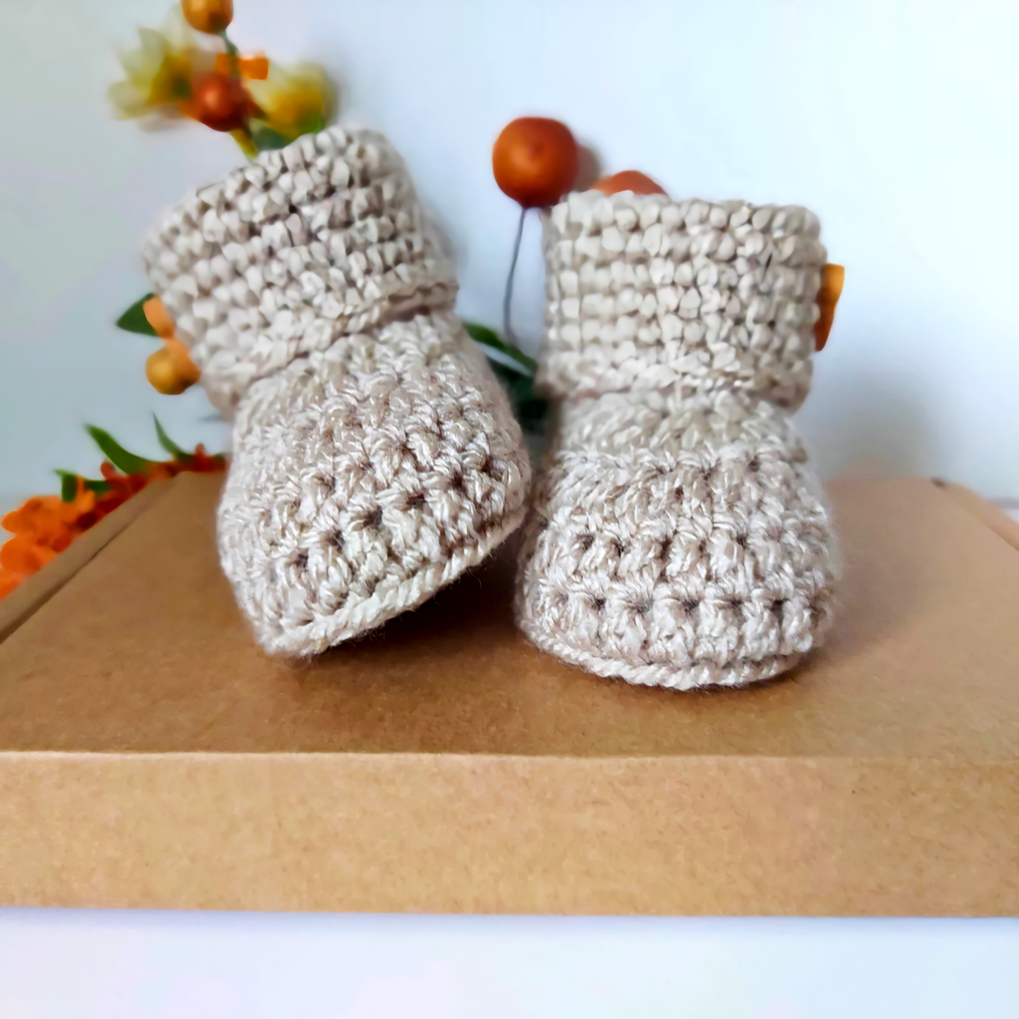 Handmade Handmade Crochet Baby Booties with Teddy Button - Sizes Newborn, 0-3 and 3-6 Months – Baby Booties crafted in soft acrylic yarn and available in multiple colours by Twisted by the Sea.