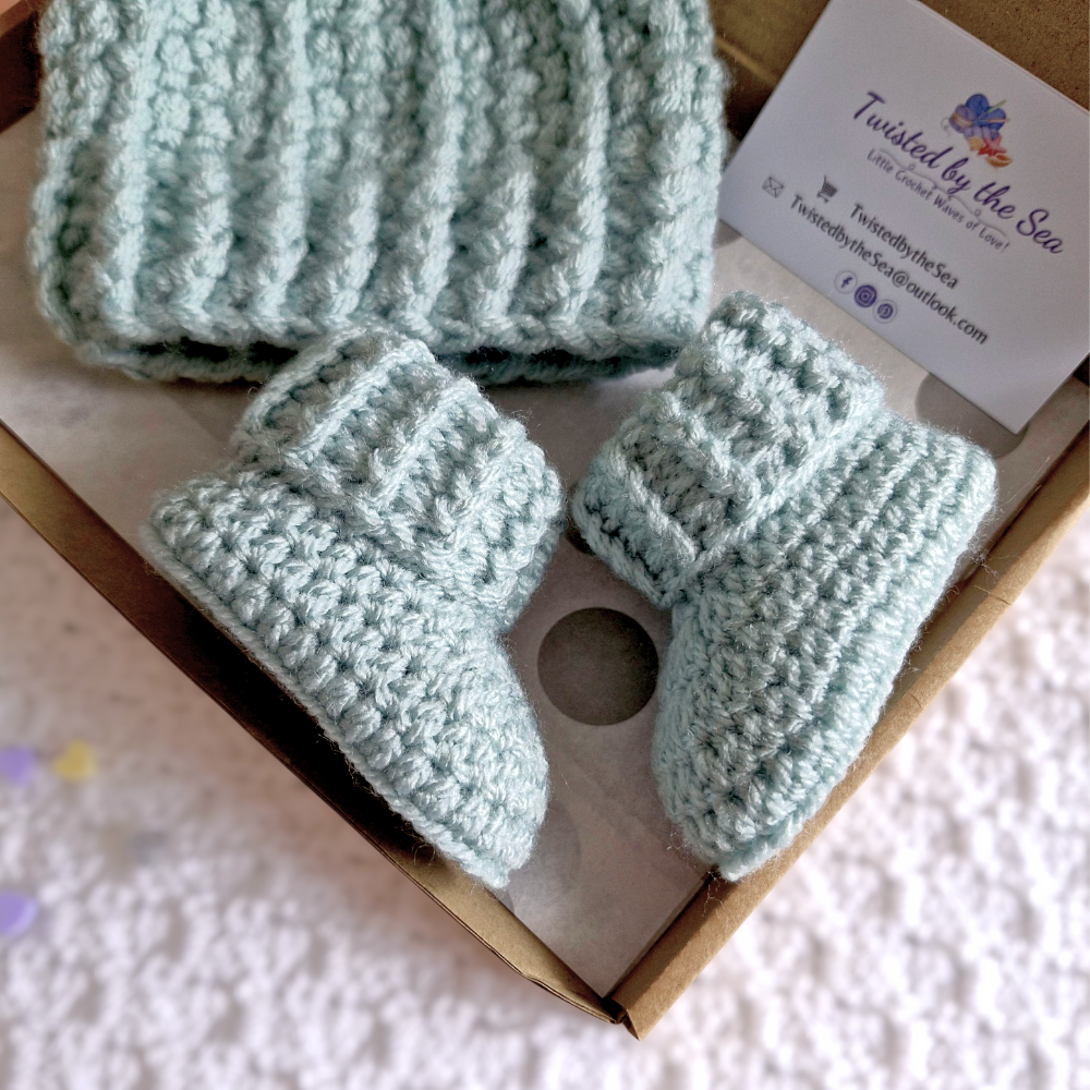 Handmade Newborn Baby Gift Set – Handmade Crochet Hat with Matching Booties – crafted in soft acrylic yarn and available in multiple colours by Twisted by the Sea.