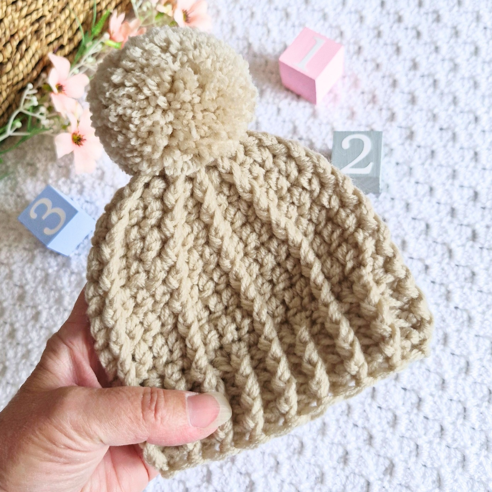 Handmade Handmade Crochet Pom Pom Baby Hat – Newborn to 12 Months – Beanie Hat crafted in soft acrylic yarn and available in multiple colours by Twisted by the Sea.