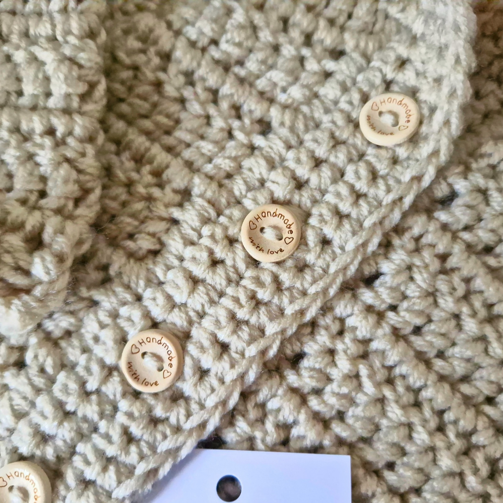 Handmade Crochet Baby Hooded Cardigan – Newborn to 12 Months – Baby Toddler Cardigans crafted in soft acrylic yarn and available in multiple colours by Twisted by the Sea.