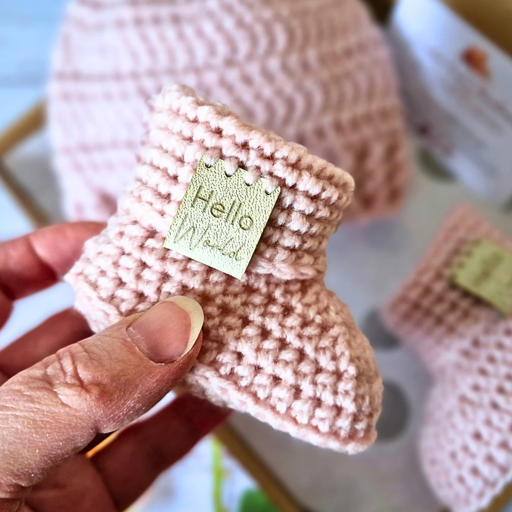 Handmade Hello World Crochet Baby Hat and Booties Set - Handmade Pom-Pom Newborn Gift (0-6 Months) – crafted in soft acrylic yarn and available in multiple colours by Twisted by the Sea.