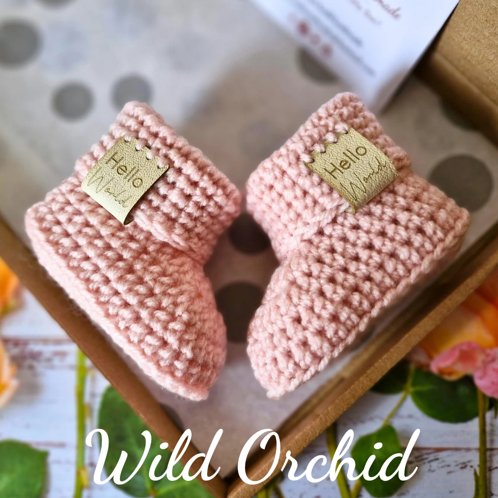 Handmade Hello World Crochet Baby Hat and Booties Set - Handmade Pom-Pom Newborn Gift (0-6 Months) – crafted in soft acrylic yarn and available in multiple colours by Twisted by the Sea.