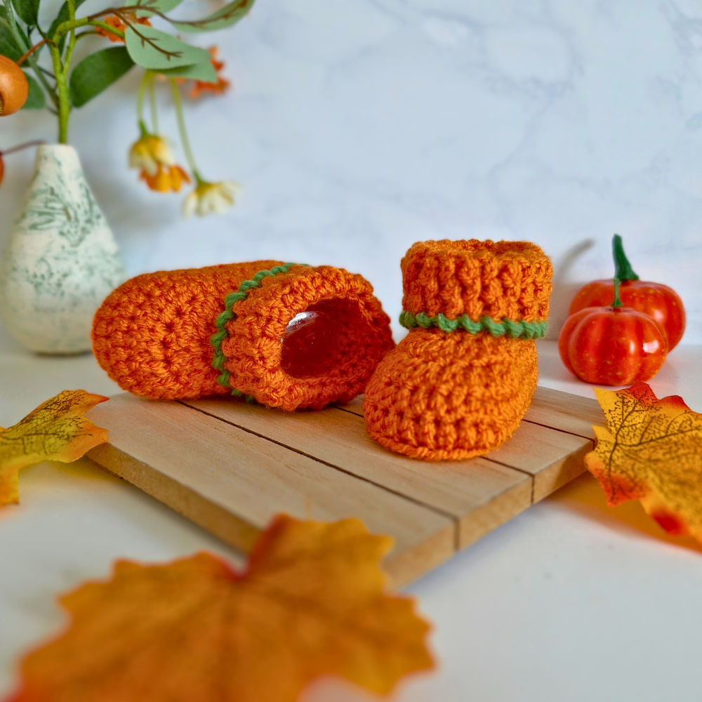 Handmade Handmade Pumpkin Crochet Baby Booties – Baby Booties crafted in soft acrylic yarn and available in multiple colours by Twisted by the Sea.