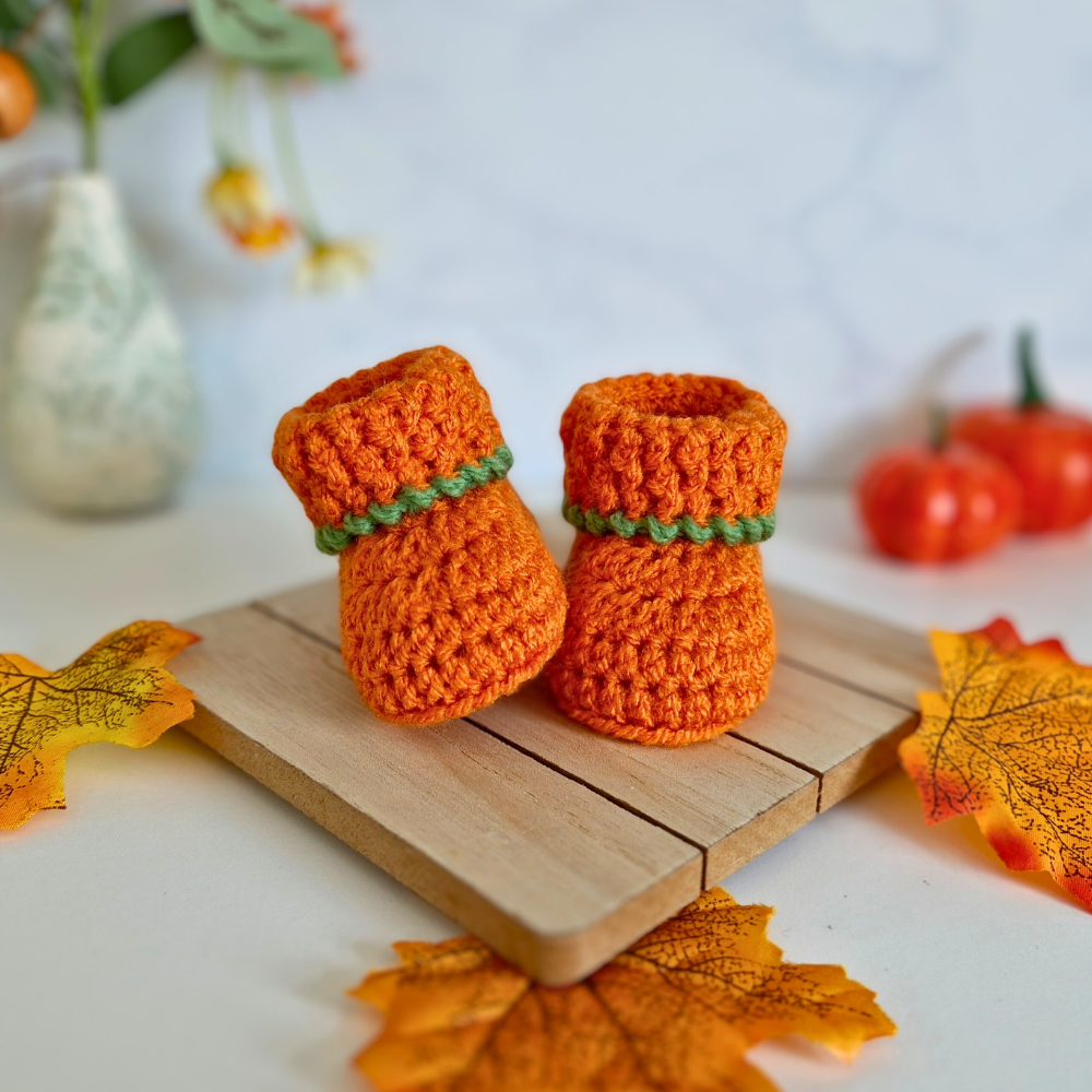 Handmade Handmade Crochet Pumpkin Baby Hat & Booties Set – Autumn Gift – Hat and Bootie Set crafted in soft acrylic yarn and available in multiple colours by Twisted by the Sea.