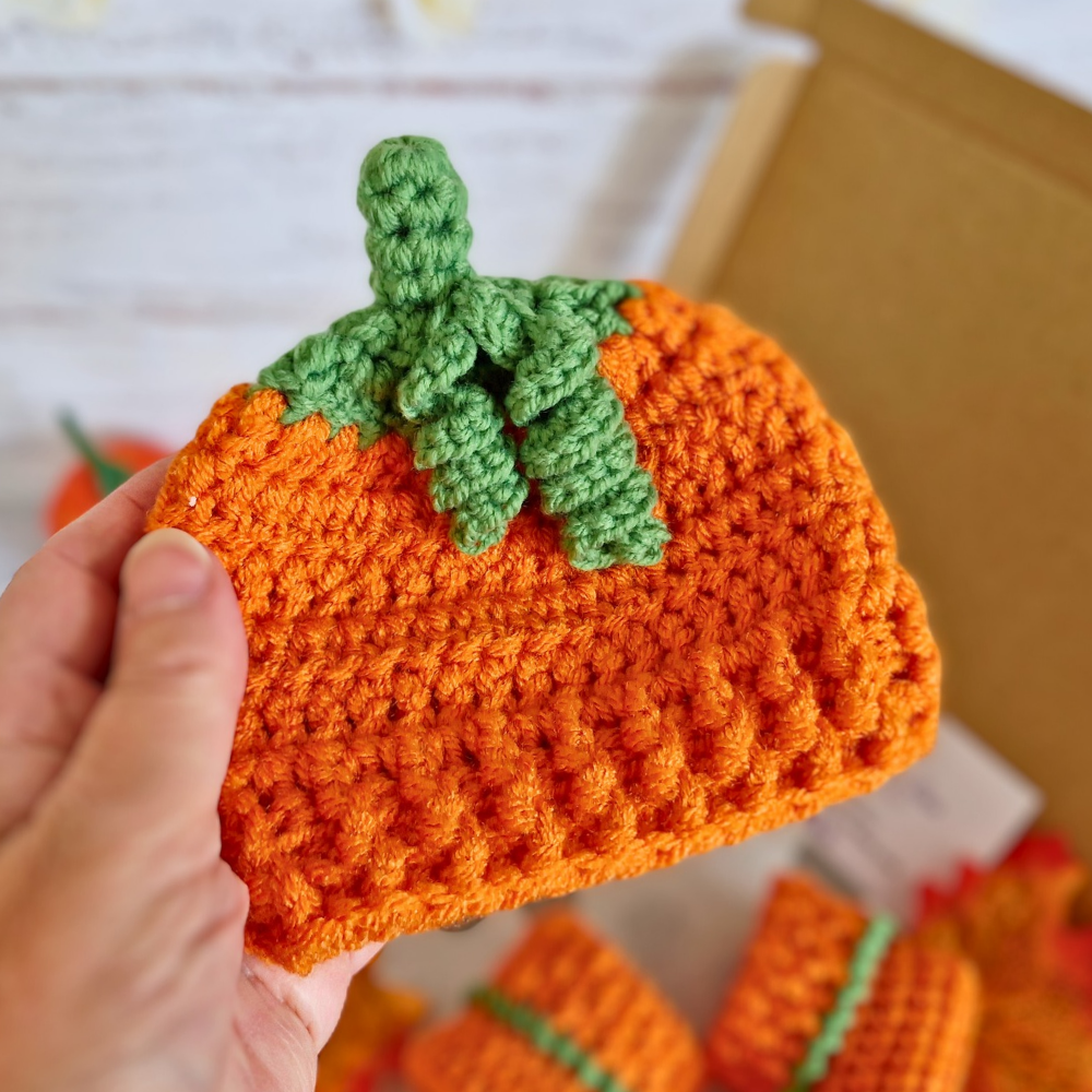 Handmade Handmade Crochet Pumpkin Baby Hat – Autumn Baby Gift – Beanie Hat crafted in soft acrylic yarn and available in multiple colours by Twisted by the Sea.