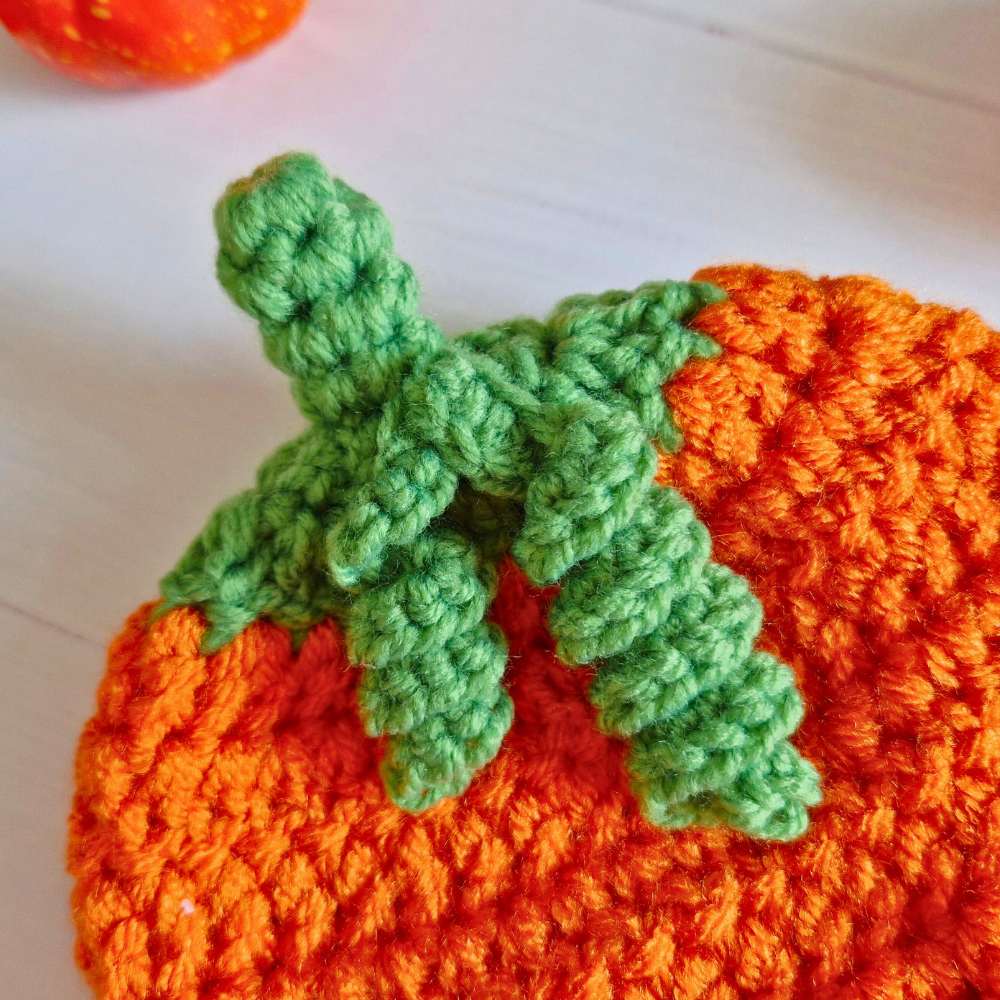 Handmade Handmade Crochet Pumpkin Baby Hat – Autumn Baby Gift – Beanie Hat crafted in soft acrylic yarn and available in multiple colours by Twisted by the Sea.