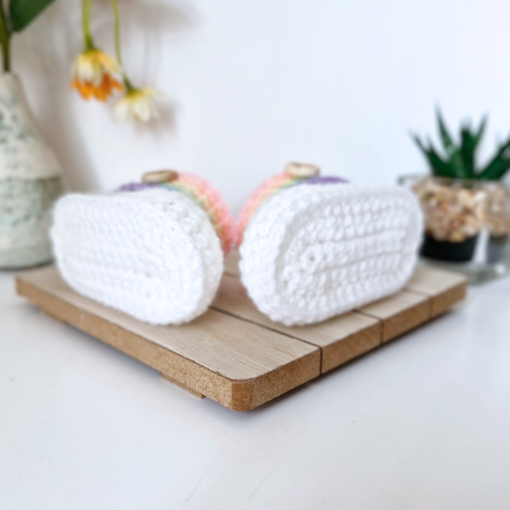 Handmade Rainbow Baby Crochet Booties, Gender Neutral Keepsake Gift – Baby Booties crafted in soft acrylic yarn and available in multiple colours by Twisted by the Sea.