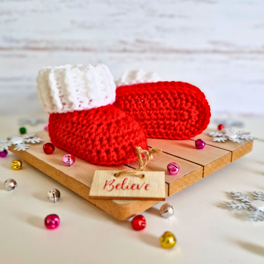 Handmade Handmade Red & White Christmas Crochet Baby Booties – Newborn to 6 Months – Baby Booties crafted in soft acrylic yarn and available in multiple colours by Twisted by the Sea.