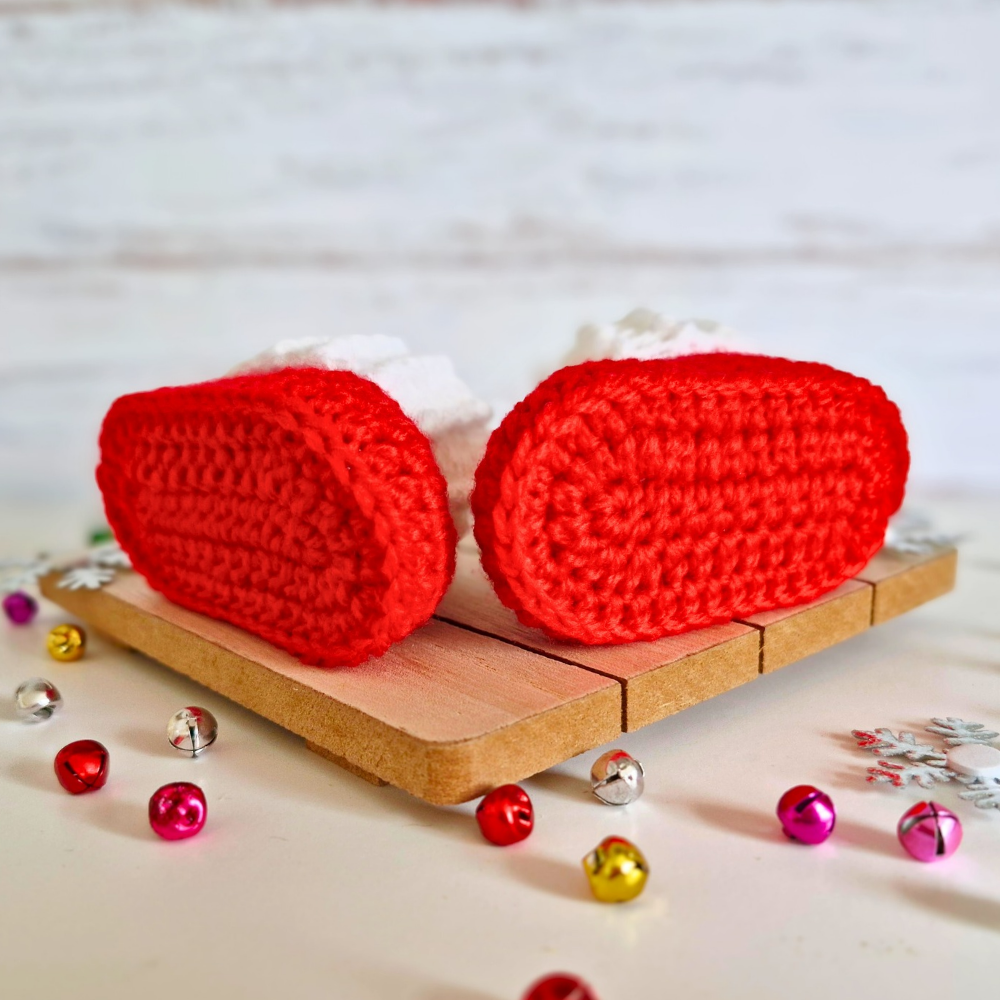 Handmade Handmade Red & White Christmas Crochet Baby Booties – Newborn to 6 Months – Baby Booties crafted in soft acrylic yarn and available in multiple colours by Twisted by the Sea.