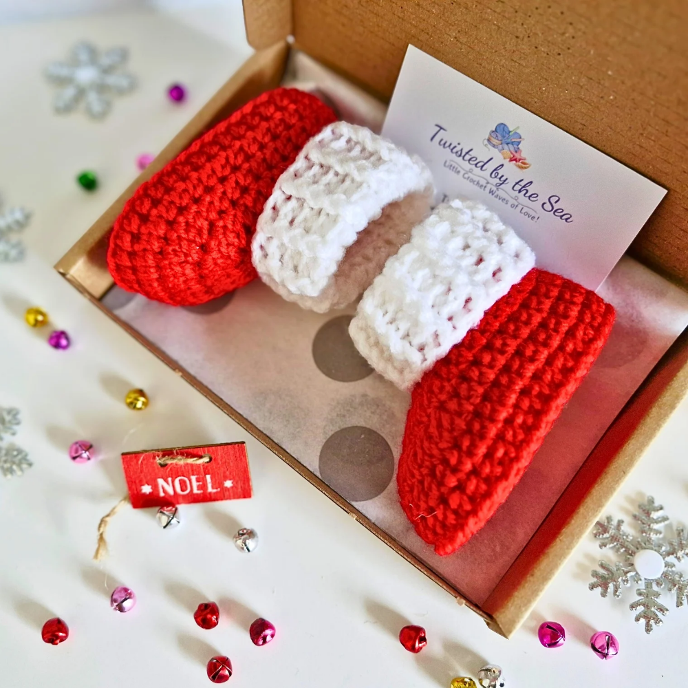 Handmade Handmade Red & White Christmas Crochet Baby Booties – Newborn to 6 Months – Baby Booties crafted in soft acrylic yarn and available in multiple colours by Twisted by the Sea.
