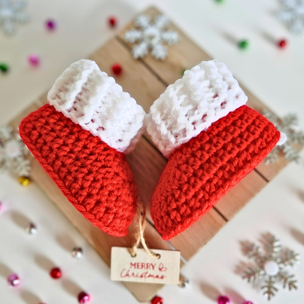 Handmade Handmade Red & White Christmas Crochet Baby Booties – Newborn to 6 Months – Baby Booties crafted in soft acrylic yarn and available in multiple colours by Twisted by the Sea.