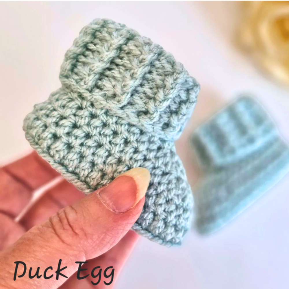 Handmade Baby Booties Crochet With Ridged Cuff – Baby Booties crafted in soft acrylic yarn and available in multiple colours by Twisted by the Sea.