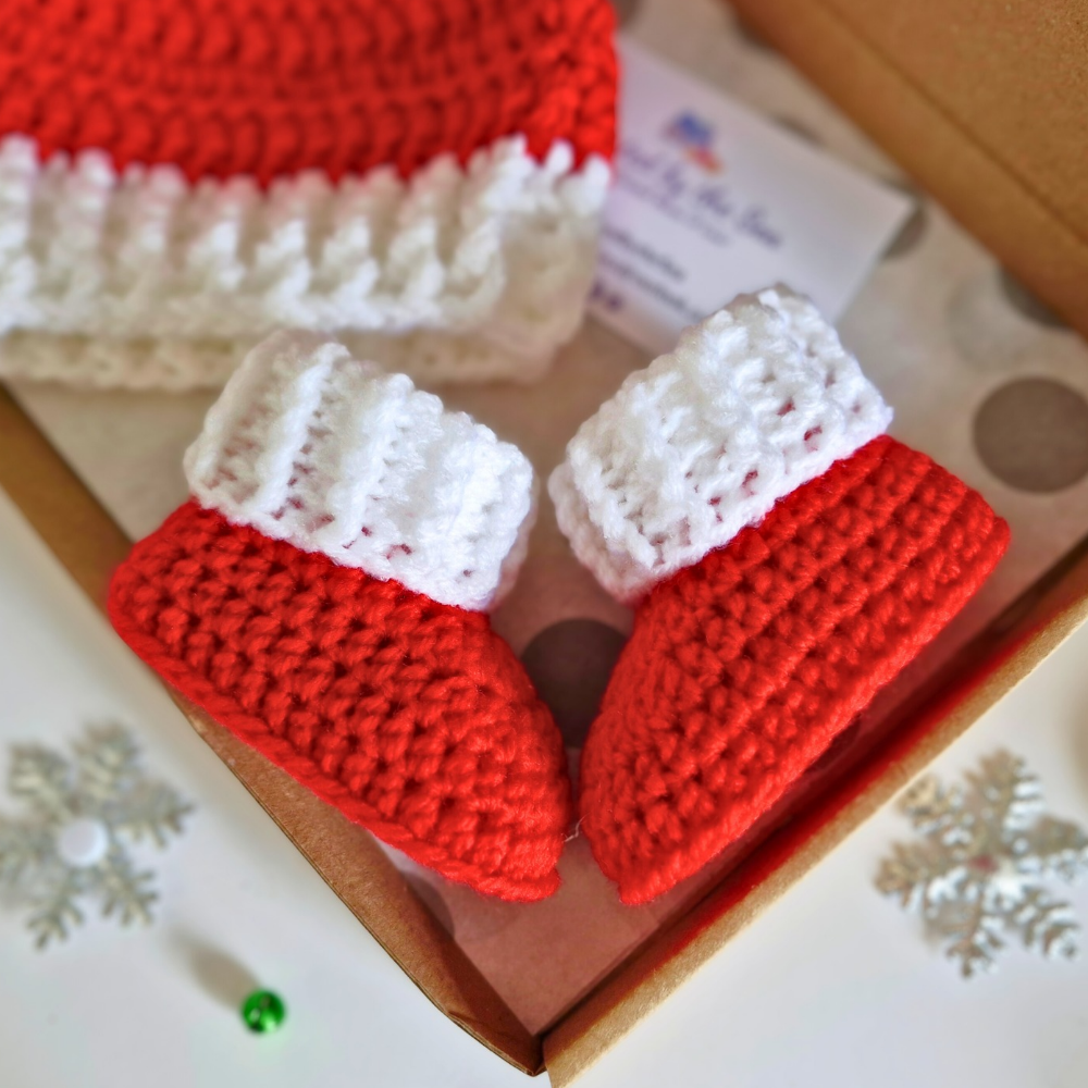 Handmade Handmade Christmas Baby Hat & Bootie Set – Red and White (Newborn to 6 Months) – Hat and Bootie Set crafted in soft acrylic yarn and available in multiple colours by Twisted by the Sea.