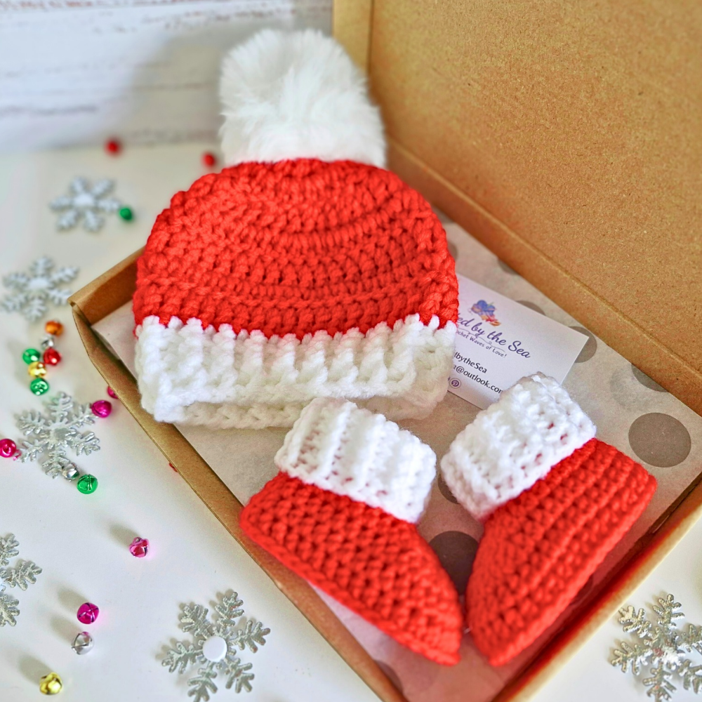 Handmade Handmade Christmas Baby Hat & Bootie Set – Red and White (Newborn to 6 Months) – Hat and Bootie Set crafted in soft acrylic yarn and available in multiple colours by Twisted by the Sea.