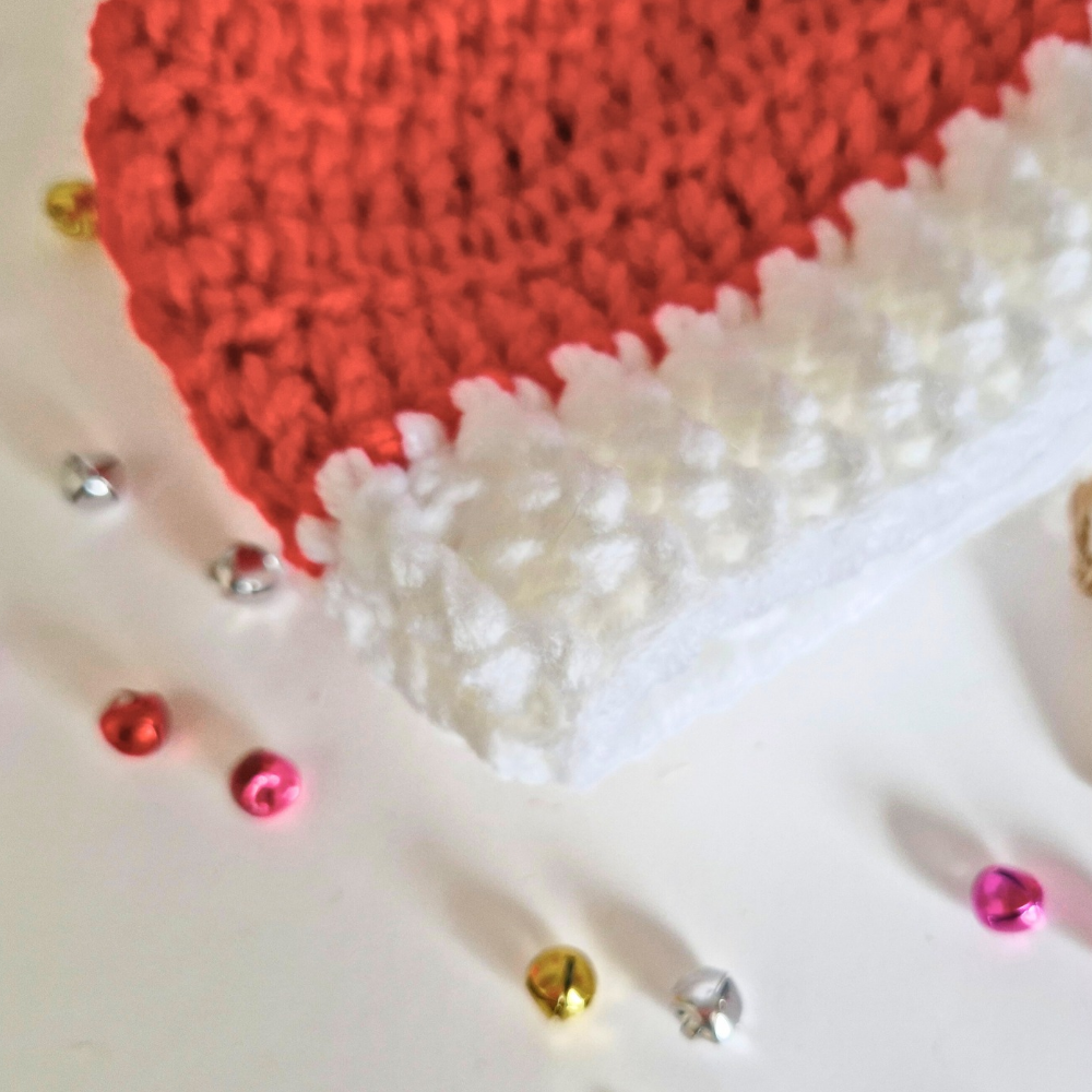 Handmade Handmade Christmas Baby Hat – Red & White Pom Pom Beanie (Newborn to 6 Months) – Pom Pom Hat crafted in soft acrylic yarn and available in multiple colours by Twisted by the Sea.