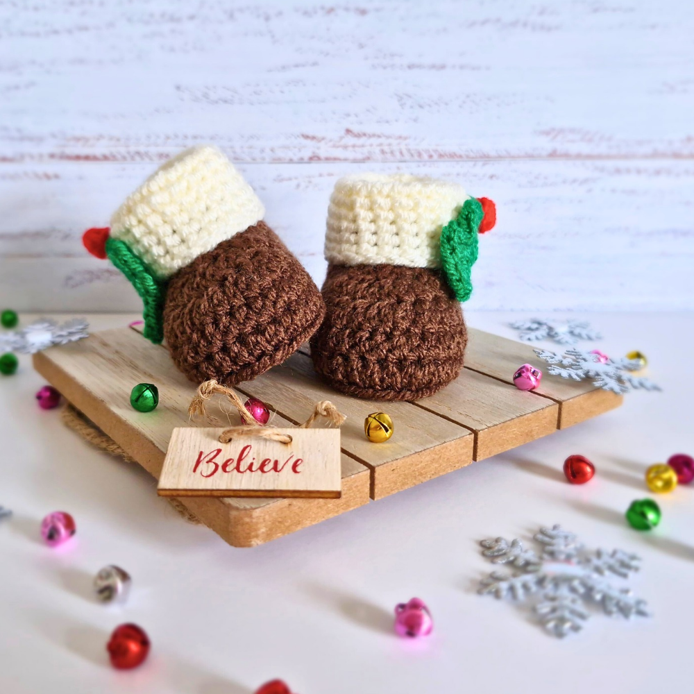 Handmade Christmas Pudding Baby Booties – Handmade Crochet Gift for Newborns – Baby Booties crafted in soft acrylic yarn and available in multiple colours by Twisted by the Sea.
