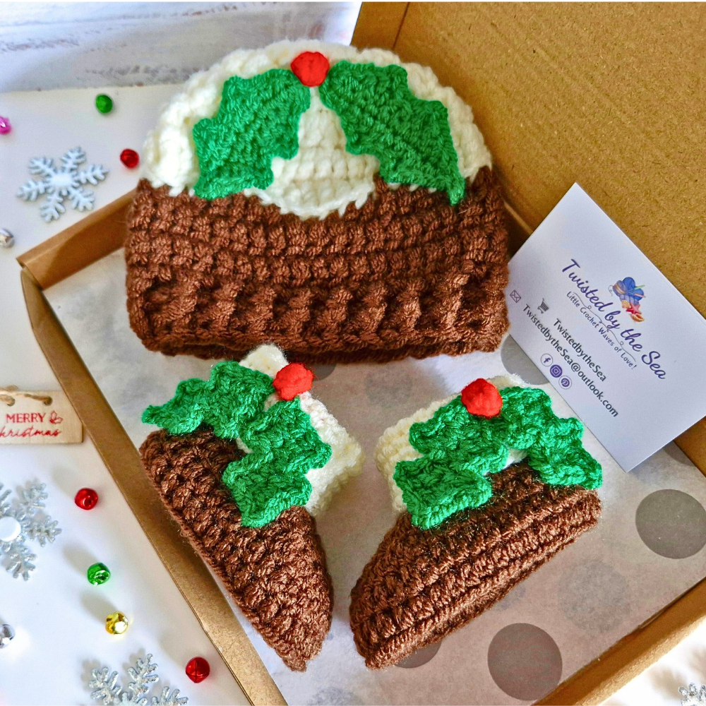 Handmade Christmas Pudding Baby Hat with Holly & Berry – Beanie Hat crafted in soft acrylic yarn and available in multiple colours by Twisted by the Sea.