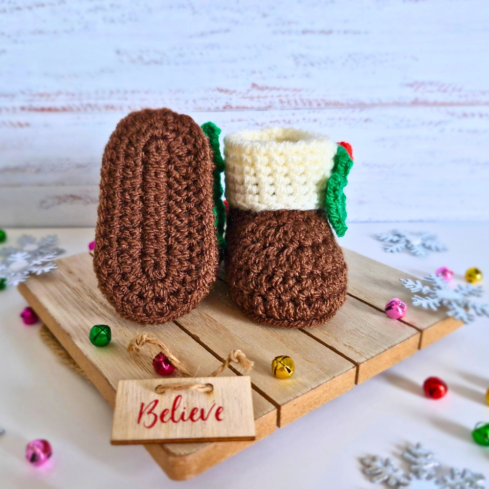 Handmade Christmas Pudding Baby Booties – Handmade Crochet Gift for Newborns – Baby Booties crafted in soft acrylic yarn and available in multiple colours by Twisted by the Sea.