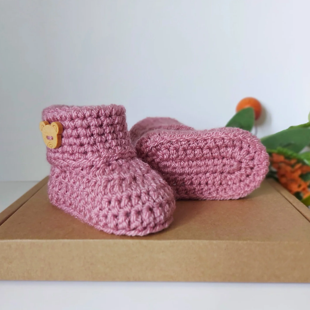 Handmade Handmade Crochet Baby Booties with Teddy Button - Sizes Newborn, 0-3 and 3-6 Months – Baby Booties crafted in soft acrylic yarn and available in multiple colours by Twisted by the Sea.