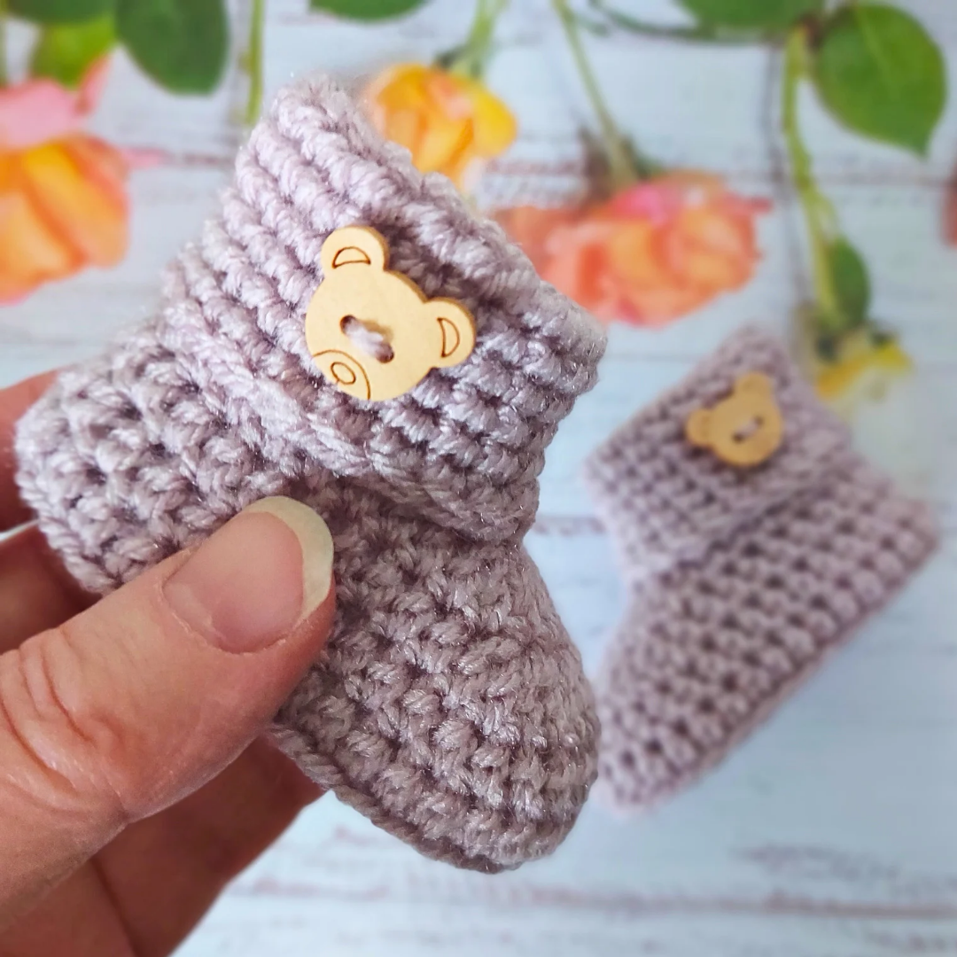 Handmade Handmade Crochet Baby Booties with Teddy Button - Sizes Newborn, 0-3 and 3-6 Months – Baby Booties crafted in soft acrylic yarn and available in multiple colours by Twisted by the Sea.