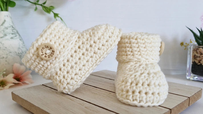Handmade crochet newborn baby booties in cream