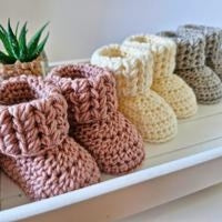 3 pairs of newborn baby booties in pink, cream and silver 