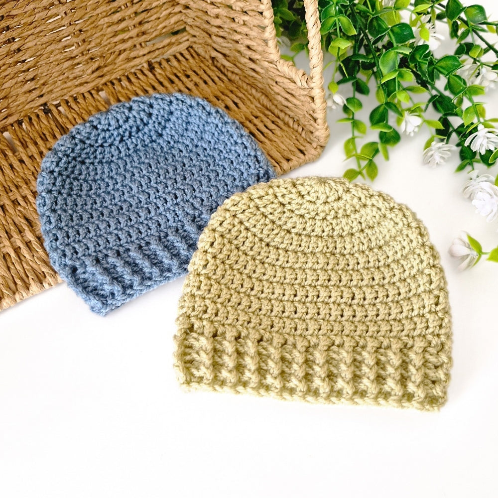 A collection of handmade crochet baby beanie hats