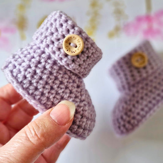 Handmade Crochet Baby Booties – Soft and Cosy Handmade Shoes for Newborns – Baby Booties crafted in soft acrylic yarn and available in multiple colours by Twisted by the Sea.