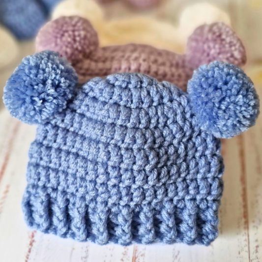 Handmade Handmade Crochet Double Pom Pom Baby Hat – Newborn to 12 Months – Beanie Hat crafted in soft acrylic yarn and available in multiple colours by Twisted by the Sea.