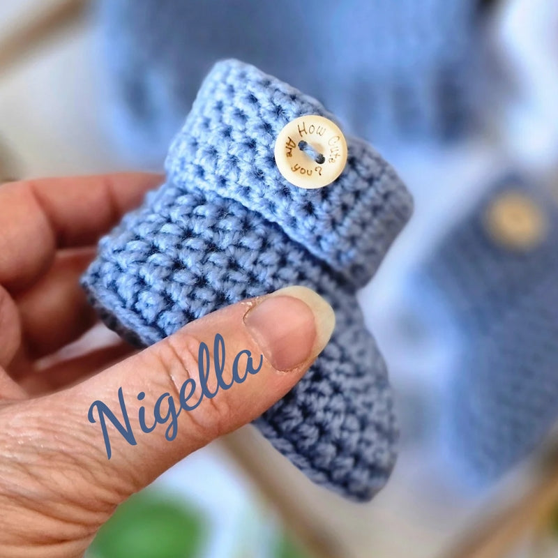 Handmade Handmade Crochet Baby Booties with ‘How Cute Are You?’ Wooden Buttons – Baby Booties crafted in soft acrylic yarn and available in multiple colours by Twisted by the Sea.