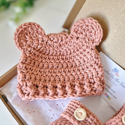 Milky tea coloured crochet baby hat with ears on a box