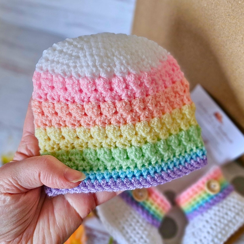 Handmade Rainbow Baby Set, Crochet Hat and Booties – Hat and Bootie Set crafted in soft acrylic yarn and available in multiple colours by Twisted by the Sea.